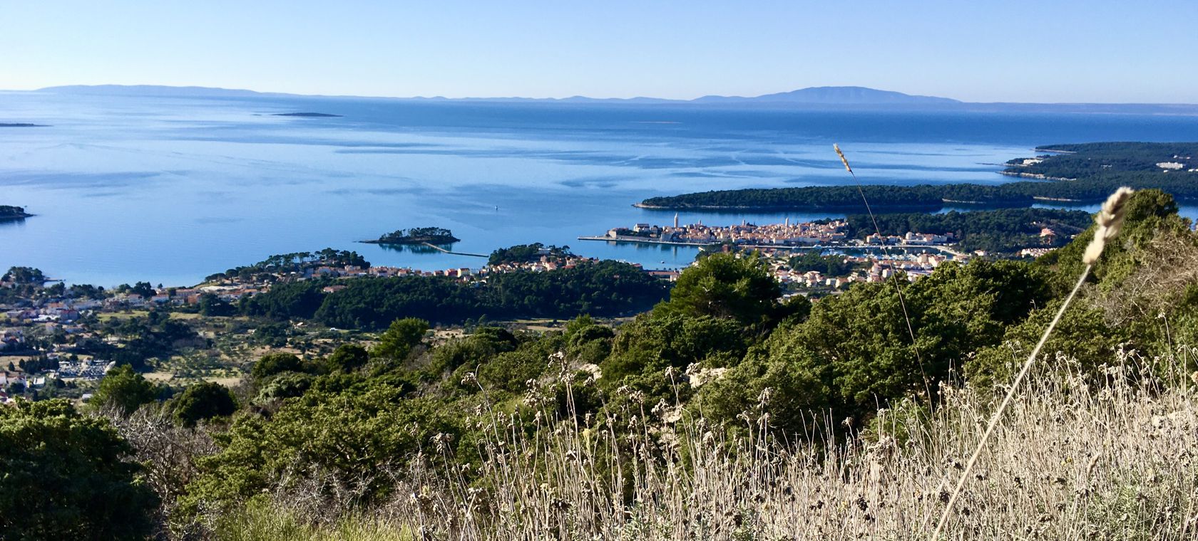 view of the town of Rab and the islands of Cres and Lošinj from the hill Kamenjak
